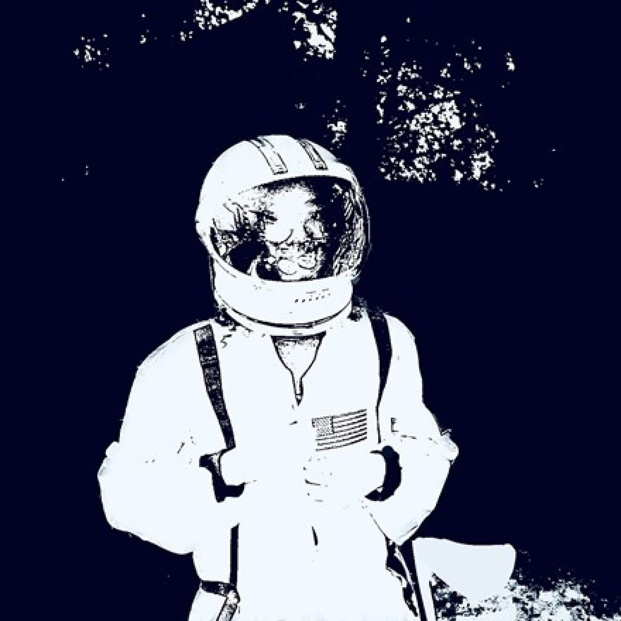 A monochrome picture of Julian in a spacesuit. The image is white on a navy blue background.